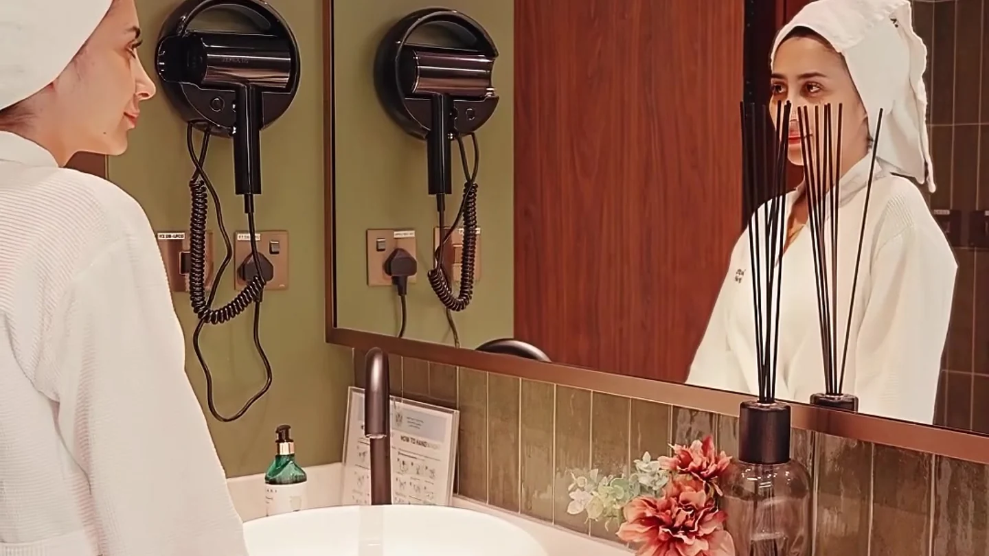 Interior and visitors in DamaRose’s Sunny Wellness video